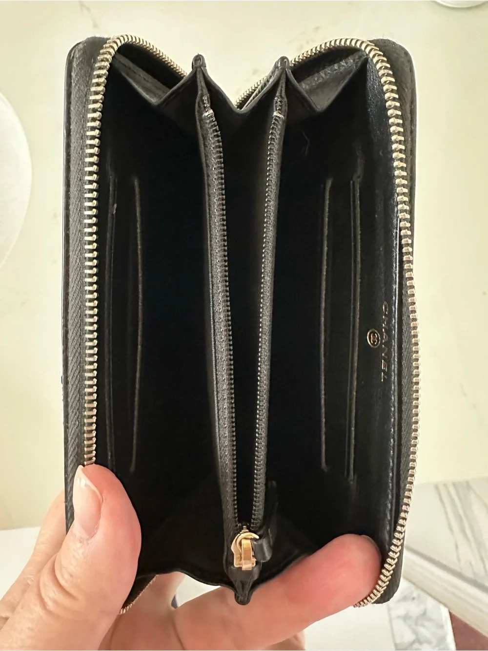 CHANEL Black Quilted Caviar Leather Zip Wallet with Gold Accents